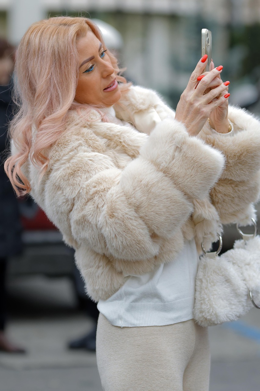 woman, young, coat, fur, posing, self, smartphone, outdoors, winter, white, beige, lifestyle
